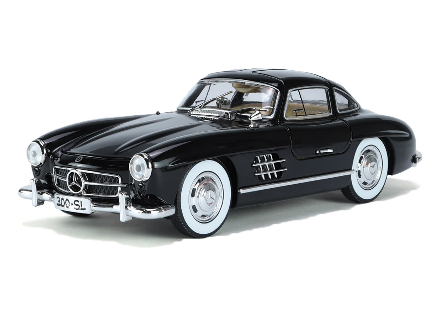 Black Mercedes-Benz 300SL model car on a white background